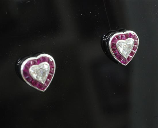 A pair of mid 20th century white gold heart shaped ruby and diamond earrings, approx. 9.5mm.